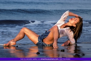 Smoking hot MILF gets her steaming hot body wet at the beach wearing white blouse and jeans shorts. - XXXonXXX - Pic 2