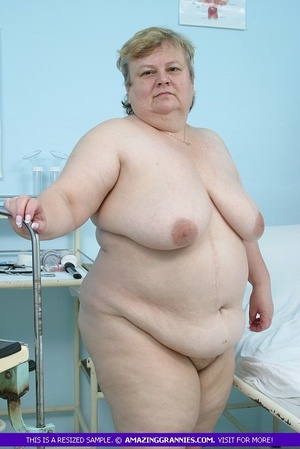 Naked granny teases with her fat body and shows her large breasts and nasty pussy in different poses in a hospital. - Picture 4