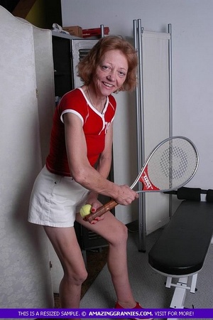 Luscious granny pose her old body while holding a tennis racket before she expose her small tits wearing her red shirt and white shorts. - XXXonXXX - Pic 6