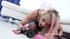 gloves-wearing blonde getting spit-roasted