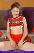 Mature cheerleader displays her small tits and sweet pussy as she pose