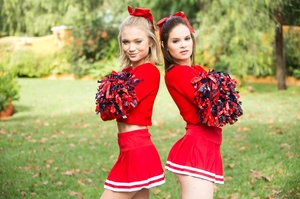 Three sexy teens in red cheerleader uniform and no panty teasing outdoors and flashing their naked goods - Picture 10