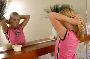 Delightful blonde wearing pink shirt and - Picture 2