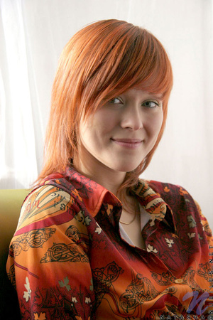 Enjoyable redhead wearing orange top and - Picture 1