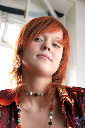 Enjoyable redhead wearing orange top and - Picture 8