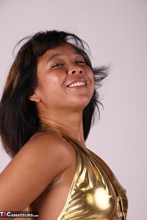 Tanned Asian slut poses rather seductively, while wearing sexy golden underwear - XXXonXXX - Pic 5