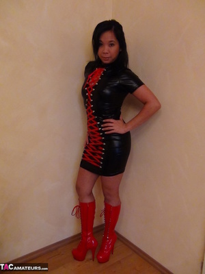 Long legged Asian cutie poses seductively, wearing latex clothes and boots - XXXonXXX - Pic 1