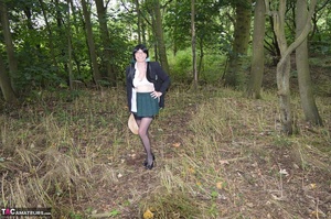 Slutty brunette milf poses seductively wearing sexy clothes in the woods - Picture 12