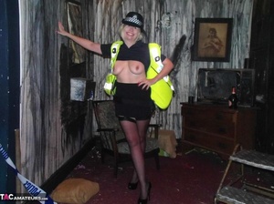 Long legged police woman poses in sexy black nylons and exposes her tits - Picture 15
