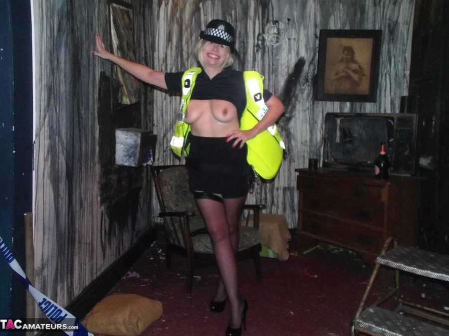 Long legged police woman poses in sexy black nylons and exposes her tits - XXXonXXX - Pic 15