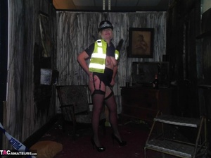 Long legged police woman poses in sexy black nylons and exposes her tits - XXXonXXX - Pic 16
