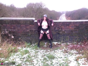 It's cold outside, but this voluptuous milf doesn't mind taking her clothes off - Picture 15
