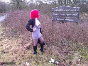 Redhead British slut takes off her clothes in nature to show her large tits - Picture 6