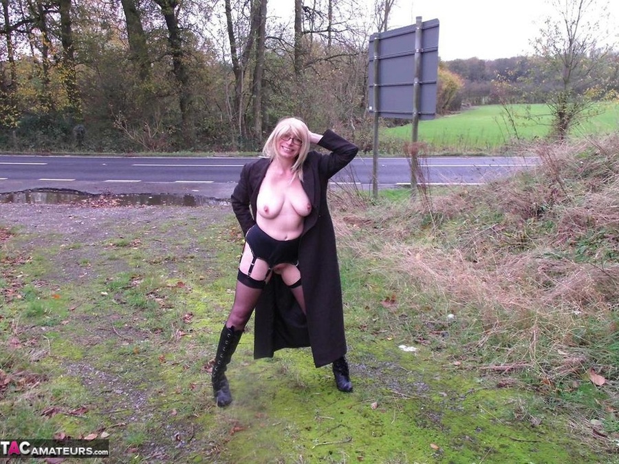 Blonde is wearing leather boots while exposing her massive tits and pussy to the cam - XXXonXXX - Pic 6
