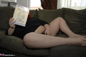 Redhead BBW bitch fingers her gaping twat, while reading a book - Picture 19