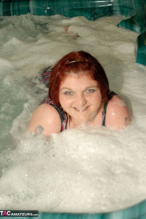 Fat chick is having a bath while the camera is focused on her massive breasts - Picture 9