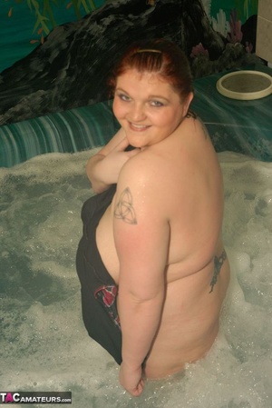 Fat chick is having a bath while the camera is focused on her massive breasts - Picture 19