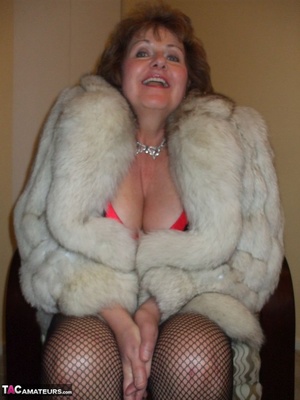 Lusty mature slut is wearing a fur coat while sucking a dick - Picture 9
