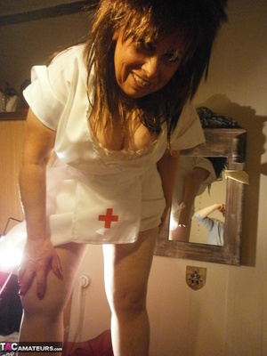 Stunning blonde nurse shows her gaping cunt to the camera and her nice tits - Picture 6