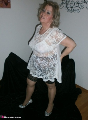 Blonde milf shows her sexy ass to the camera, while wearing hot nylons - XXXonXXX - Pic 1