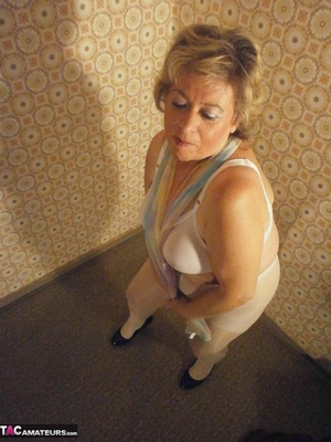 Fat-ass blonde cougar teases with her legs and feet, while in sexy nylon stockings - XXXonXXX - Pic 1