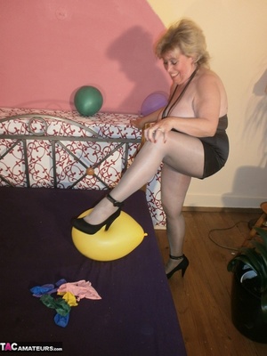 Blonde cougar plays with balloons and shows her massive tits to the cam - XXXonXXX - Pic 14