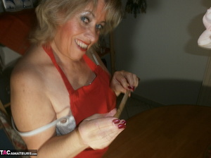 Horny blonde milf fucks her gaping snatch with a cucumber and other stuff - Picture 7