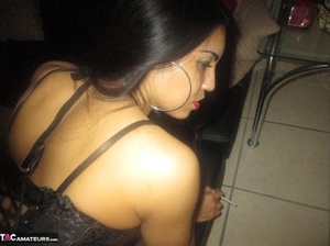 Hot Latina with big jugs strips her clothes while smoking a cigarette - XXXonXXX - Pic 1