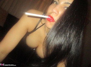 Hot Latina with big jugs strips her clothes while smoking a cigarette - XXXonXXX - Pic 3