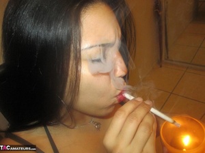 Hot Latina with big jugs strips her clothes while smoking a cigarette - Picture 6