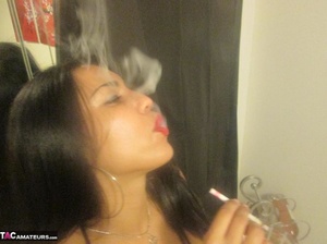Hot Latina with big jugs strips her clothes while smoking a cigarette - XXXonXXX - Pic 8