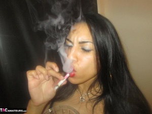 Hot Latina with big jugs strips her clothes while smoking a cigarette - XXXonXXX - Pic 12