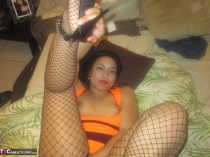 Alluring Latina spreads her legs to the camera, while wearing hot fishnet stockings - Picture 15