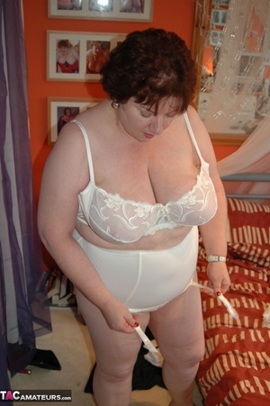 Fat bimbo is posing in sexy lingerie which makes her large tits look nice - Picture 1