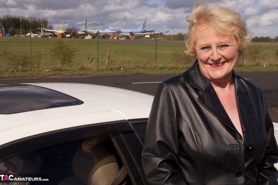 Mature bimbo with big breasts poses in sexy lingerie near a highway - XXXonXXX - Pic 14