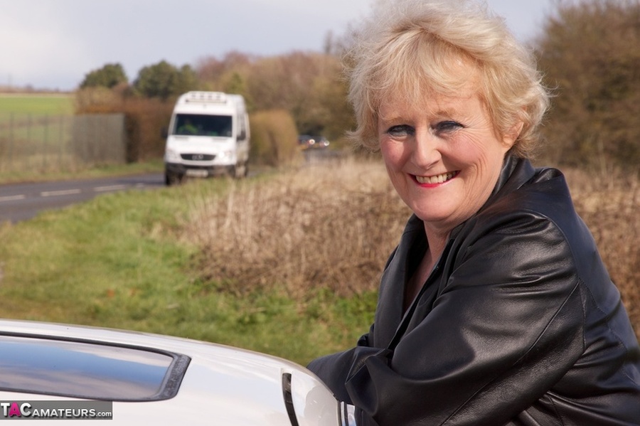 Mature bimbo with big breasts poses in sexy lingerie near a highway - XXXonXXX - Pic 17