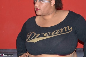 A fat, ebony, slut in a plaid skirt rubs her wet pussy with a brush handle - XXXonXXX - Pic 1
