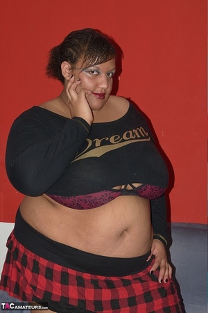 A fat, ebony, slut in a plaid skirt rubs her wet pussy with a brush handle - XXXonXXX - Pic 2