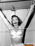 Cute chick gets tied by a hot domina, who's wearing sexy lingerie