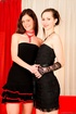 Busty brunette in black dress and skinny harlot with small tits using
