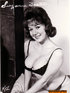 A mature, chubby, tramp with saggy tits, strikes a sexy pose for the camera