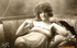 She flashes a smile and poses seductively on this beach chair