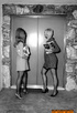 These gorgeous, vintage, whores smile and pose topless for the camera