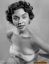 These classic, mature, beauties pose topless and smile in this artistic