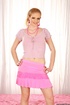 Grey eyed blonde in sexy pink outfit stripteasing on the pink bed and