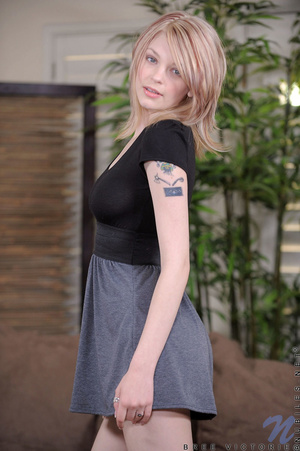 Sexy blonde bitch in black and gray dress waves at the camera and plays with her pussy - XXXonXXX - Pic 1