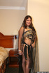 Red lipped brunette teasing in indian black outfit while posing by the