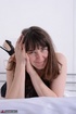showy brunette milf wearing