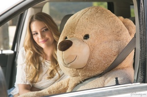 Blonde slut shows her long legs having fun with a stuffed bear. - Picture 4