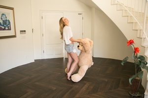 Blonde slut shows her long legs having fun with a stuffed bear. - Picture 5